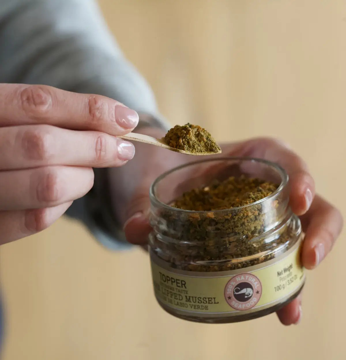 Glass jar with green lipped mussel topper for dogs and cats, natural joint health supplement.