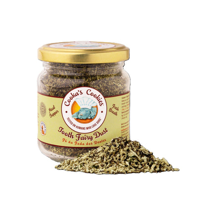 Close up of Tooth Fairy Magic Dust meal topper for dogs and cats, featuring natural seaweed, coconut, and parsley ingredients in a glass jar.